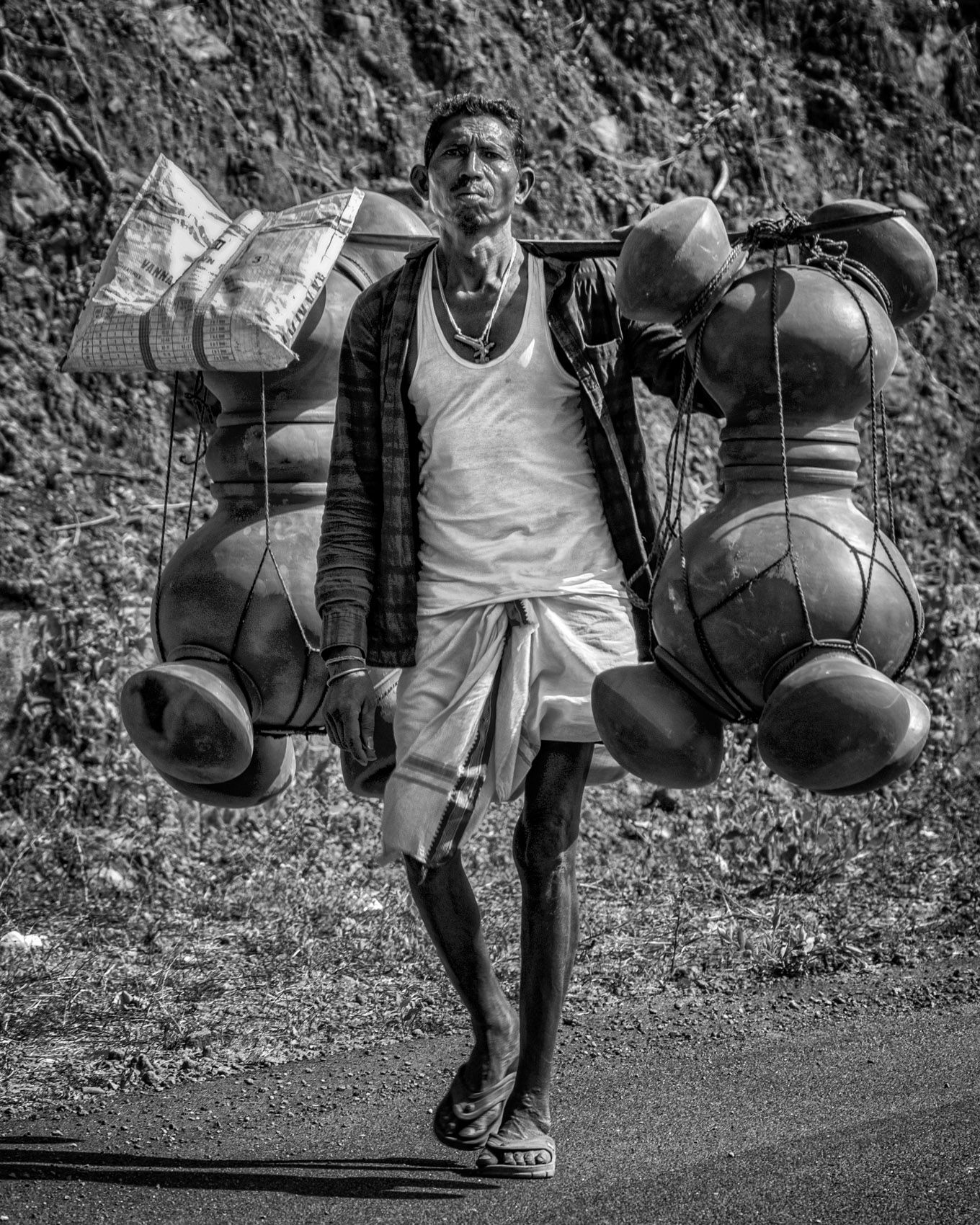 Potter Carrying His Wares to Sell in a Tribal Market (Rural Chhattisgarh) work.artisans-7.jpg