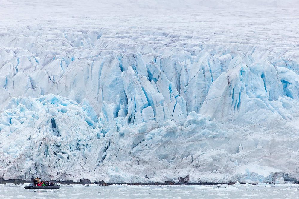 Glacier-face-with-zodiac-for-scale_B8R5592-Lilliehookbreen,-Svalbard,-Arctic.jpg