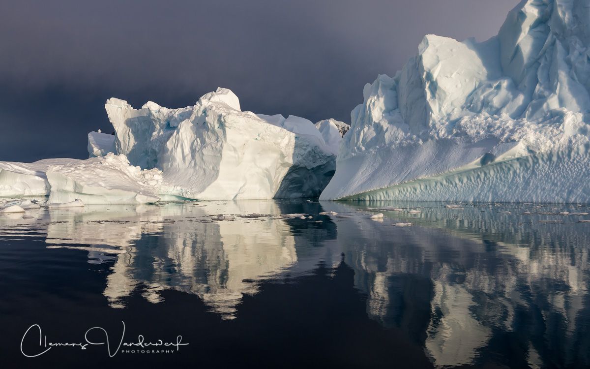 ice-berg-with-dark-sky-and-last-sunlight_s6a9219-booth-island-antarctica.jpg