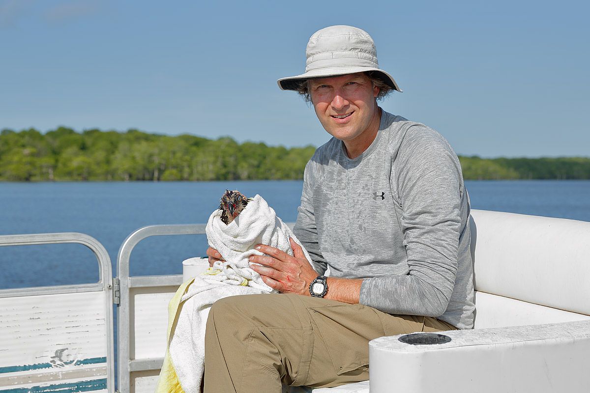 clemens-with-saved-osprey-in-towel_s6a7035-lake-blue-cypress-fl-usa.jpg