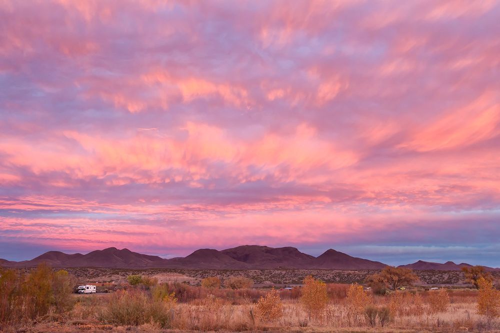 Pink-morning-sky-above-the-mountains-23100041-Bosque-del-Apache-NWR,-San-Antonio,-NM.jpg
