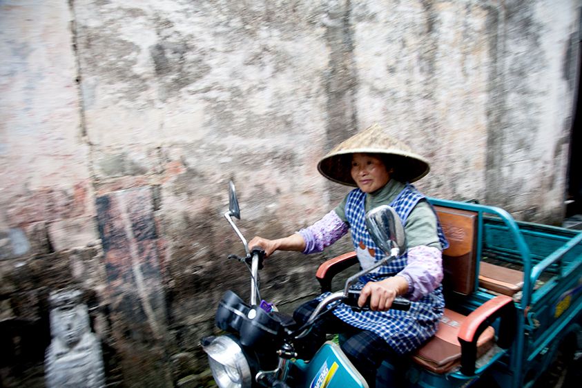 Xidi Ancient Village, China,  Copyright Melissa Lynn 2019 Woman on Motorcycle