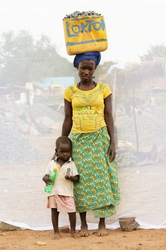 ACAN CATHERINE: AGE 29 WITH HER DAUGHTER JESSICA: AGE 2 WORKING IN QUARRY FOR 11 YEARS.
