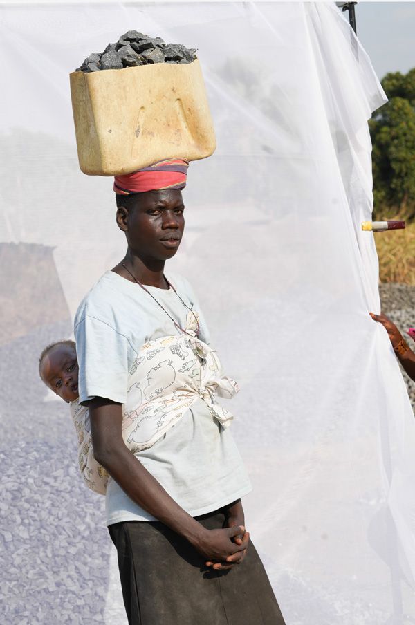 Quarry worker with her baby