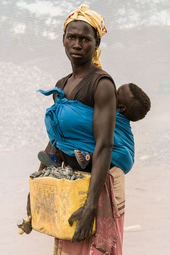 ACIRO VICKY: AGE 18 WITH HER SON MICHAEL (AGE 10 MONTHS) WORKING IN QUARRY FOR ONE YEAR