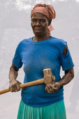  AKELLO OLGA: AGE 74 WORKING IN QUARRY FOR 28 YEARS. BREAKING STONES TO GRAVEL SIZE, FILLING ABOUT SIX JERRYCANS OF GRAVEL PER DAY