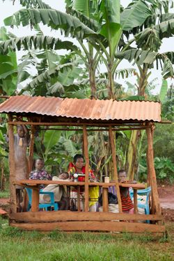 Aisha Mukyak Nyisa (age 35). dressmaker & tailor for 16 years with 5 of her 7 children.