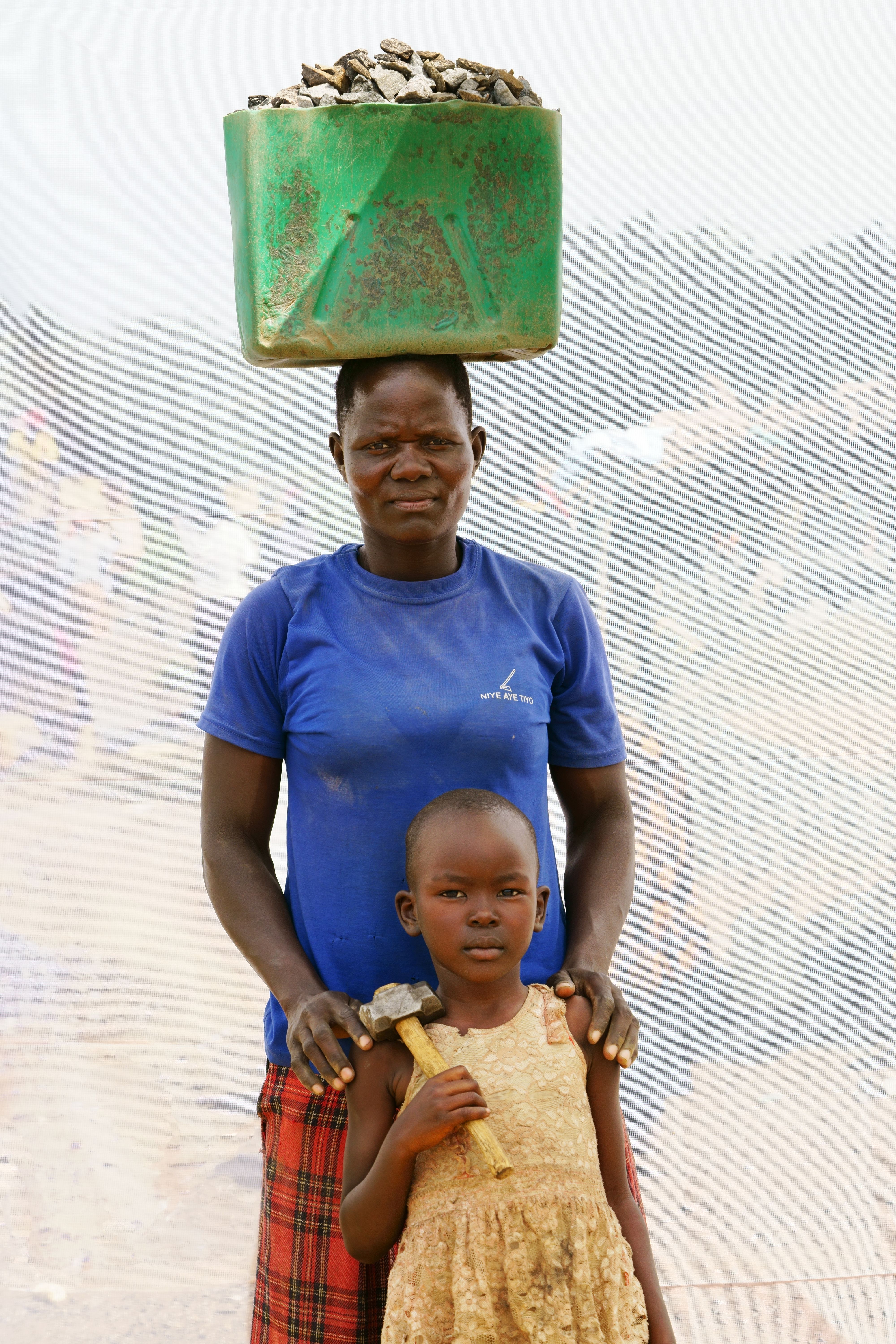 ACAN CATHERINE: AGE 27 & HER DAUGHTER PATIENCE: AGE 4. WORKING IN QUARRY FOR 10 YEARS. PATIENCE HELPS HOWEVER SHE CAN