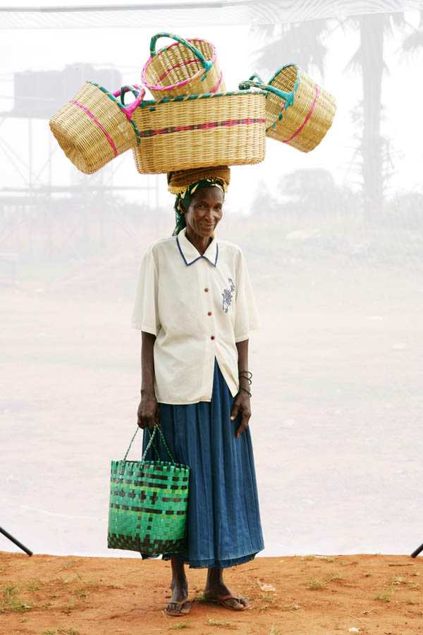 A. Christine: Age 50. Selling local woven baskets for 20 years.