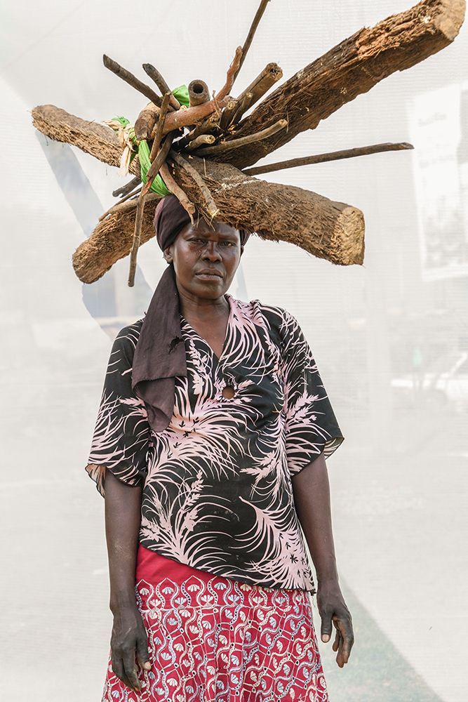 A. Christine: Age 47. Selling firewood for 10 years.
