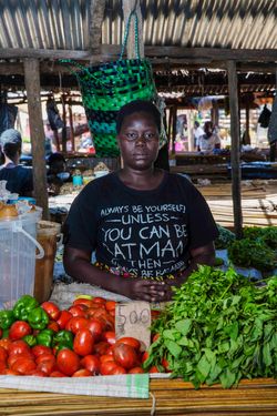 Ocwee Pamela (age31) sells vegetables at Layibi market.