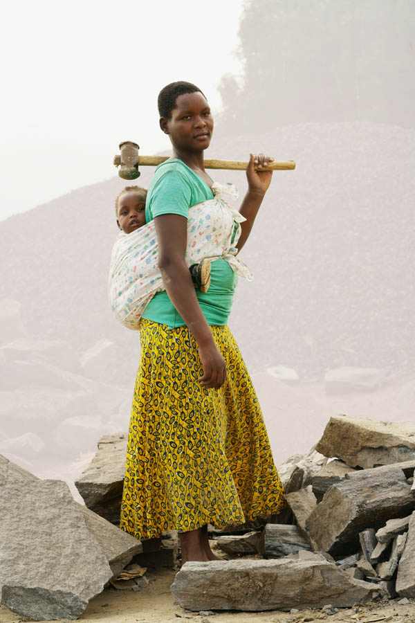 Quarry worker with her baby