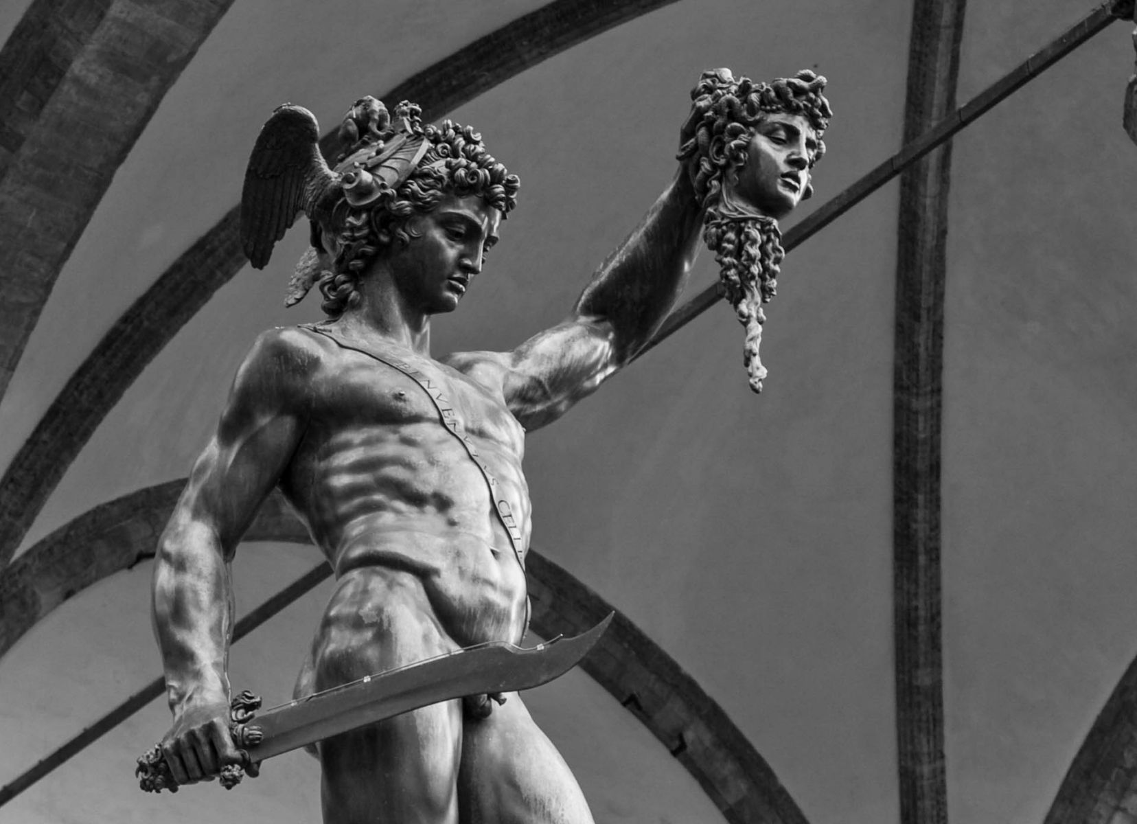 The statue of Perseus by Cellini is located in front of Loggia dei Lanzi in the Signoria district of Florence Italy. Perseus