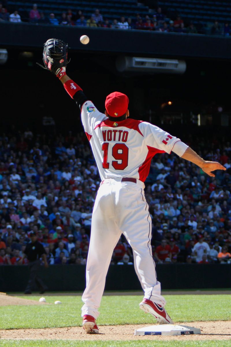 Votto keeps a foot on the bag.