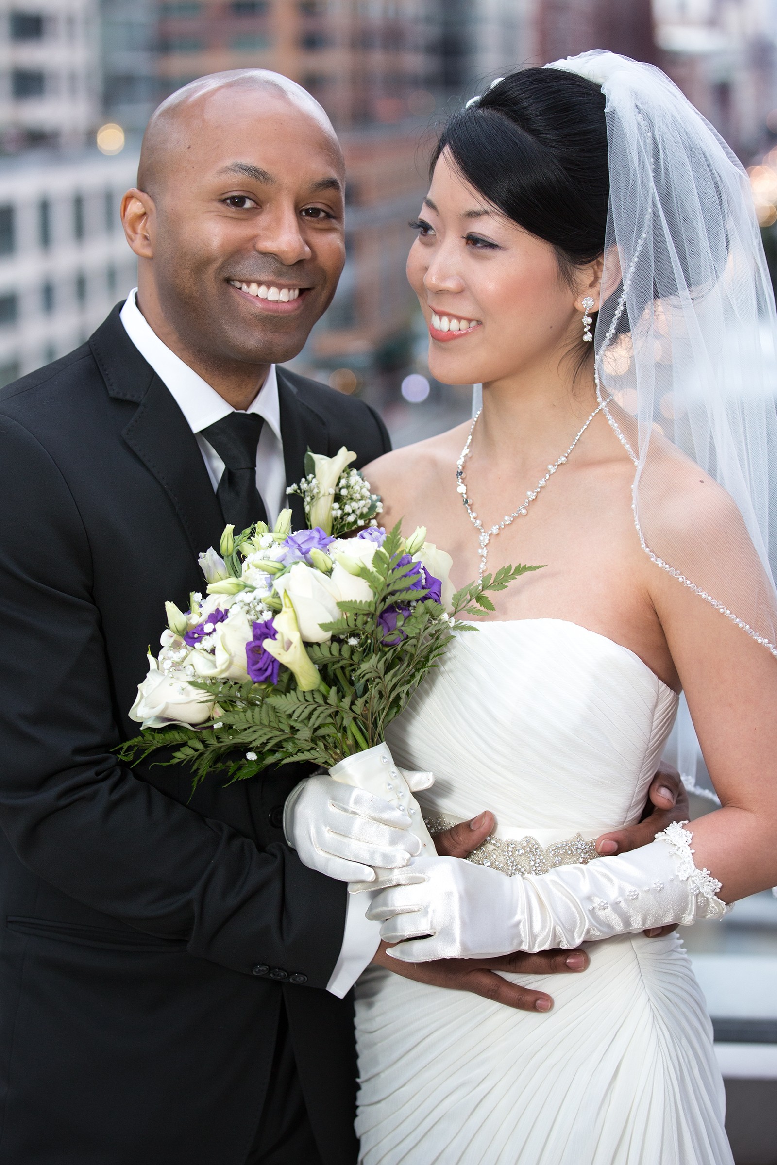 Bride and groom 3/4 portrait on Kimpton Eventi rooftop