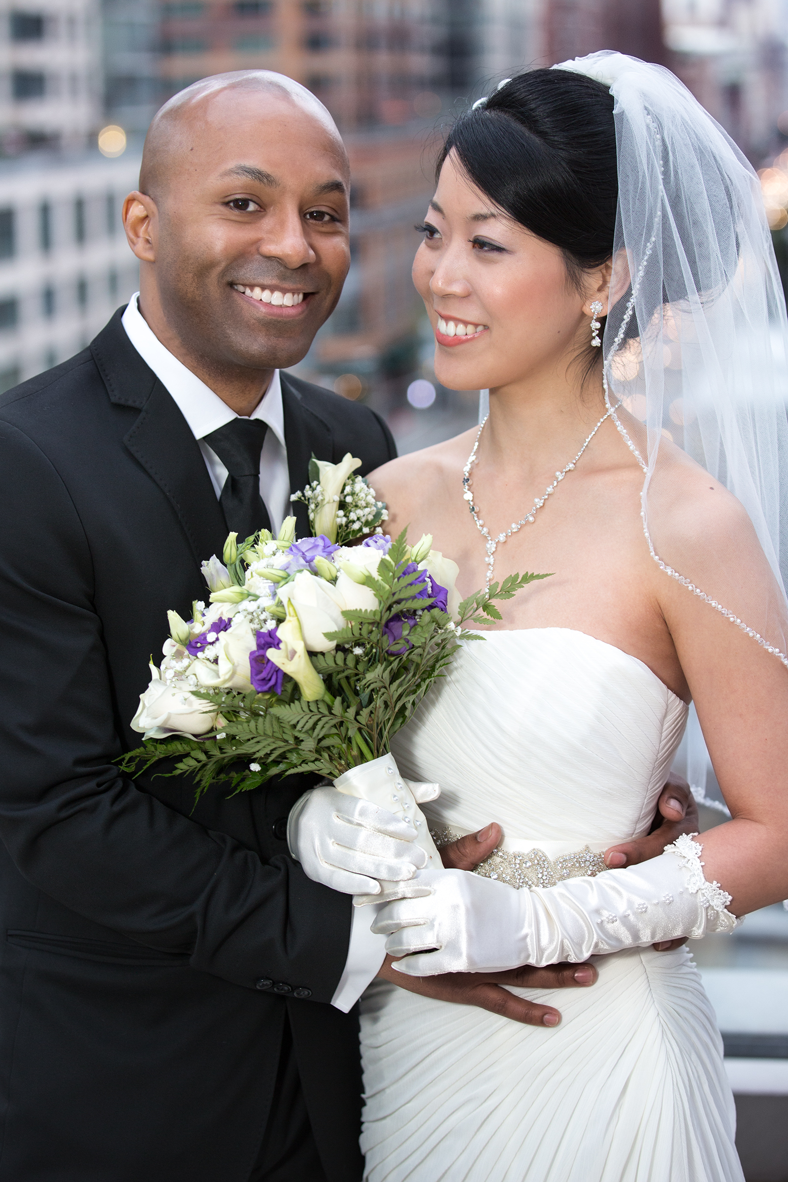 Bride and groom 3/4 portrait on Kimpton Eventi rooftop