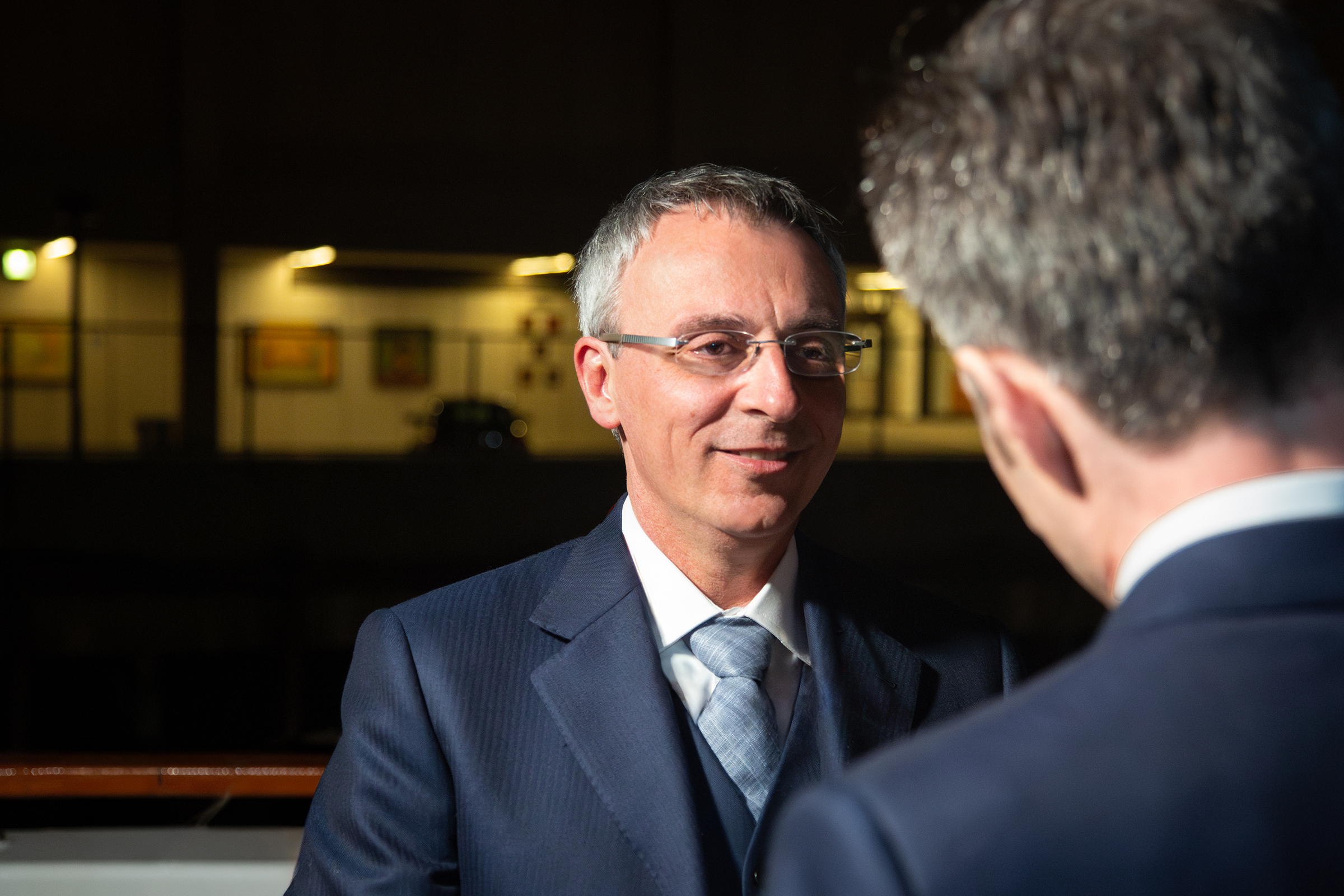 Italian groom looking lovingly at partner during vows