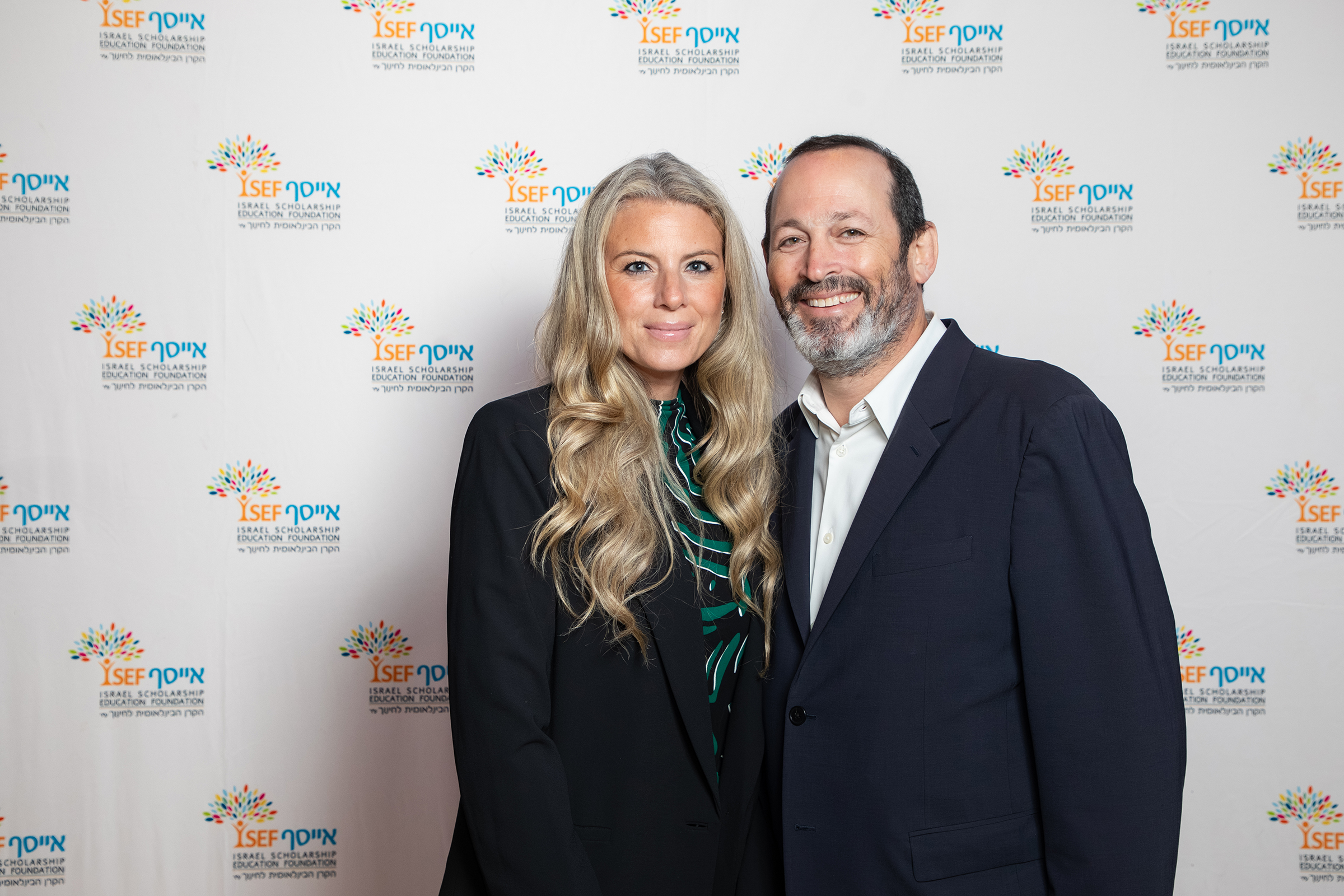 Couple posing at ISEF gala backdrop horizontal