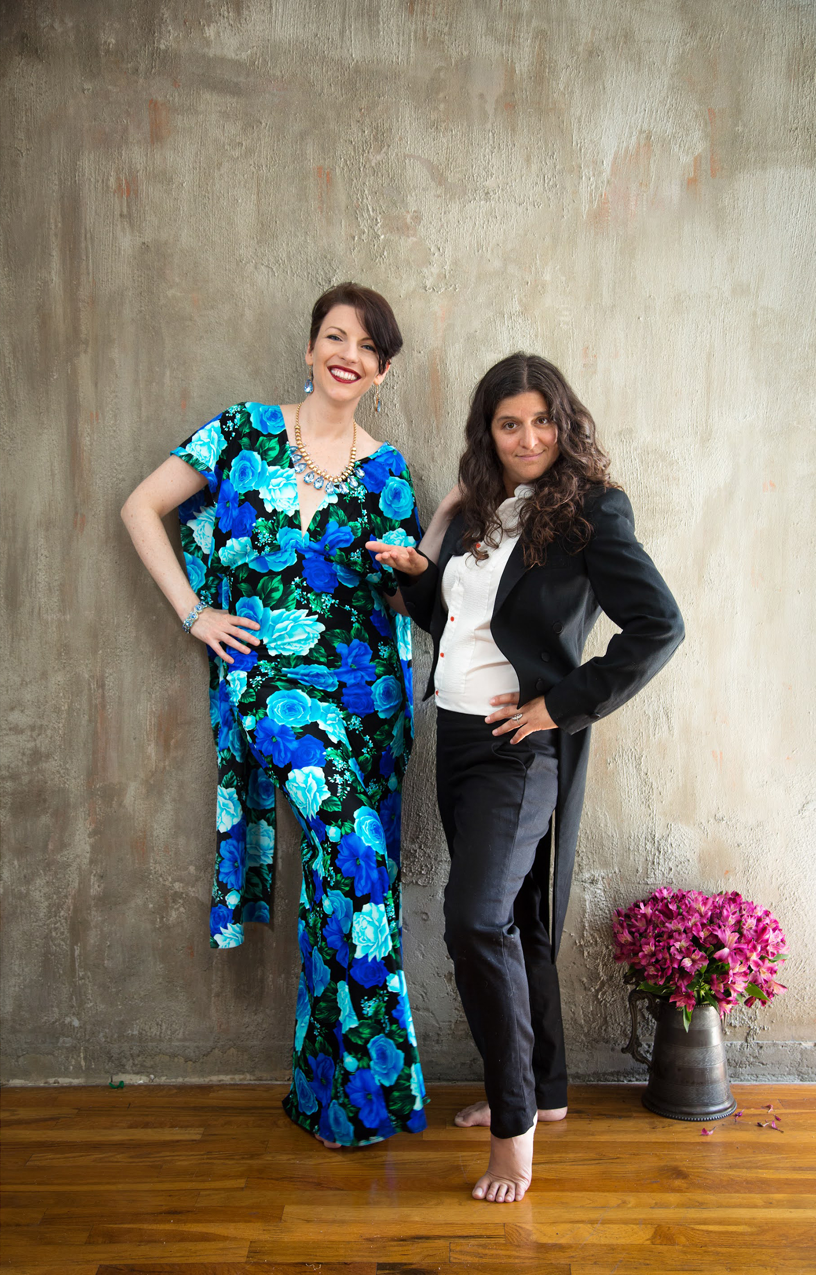 Anna posing sassily beside Lola in tuxedo pre‑wedding portrait