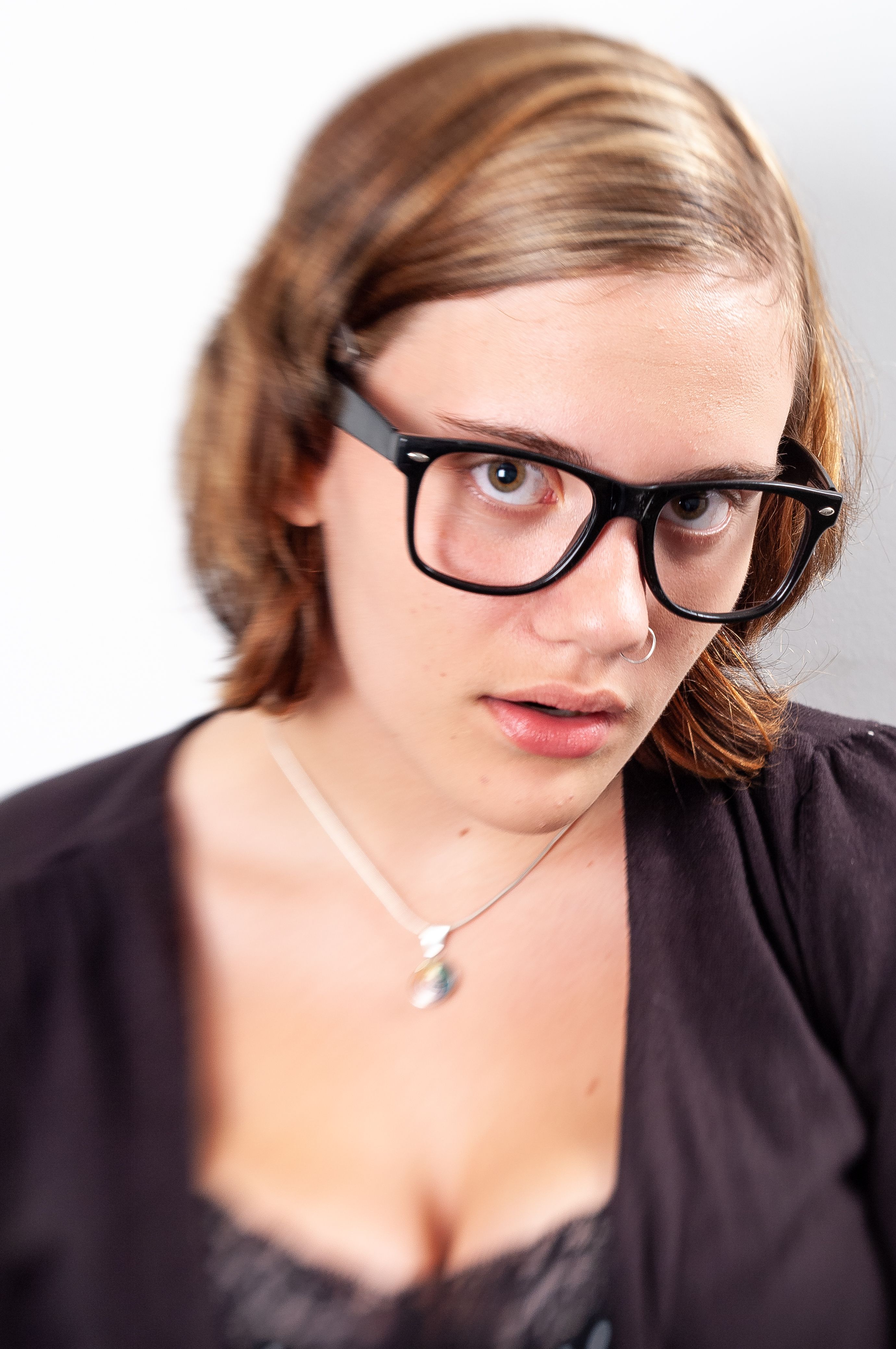 Portrait of female student with large black glasses