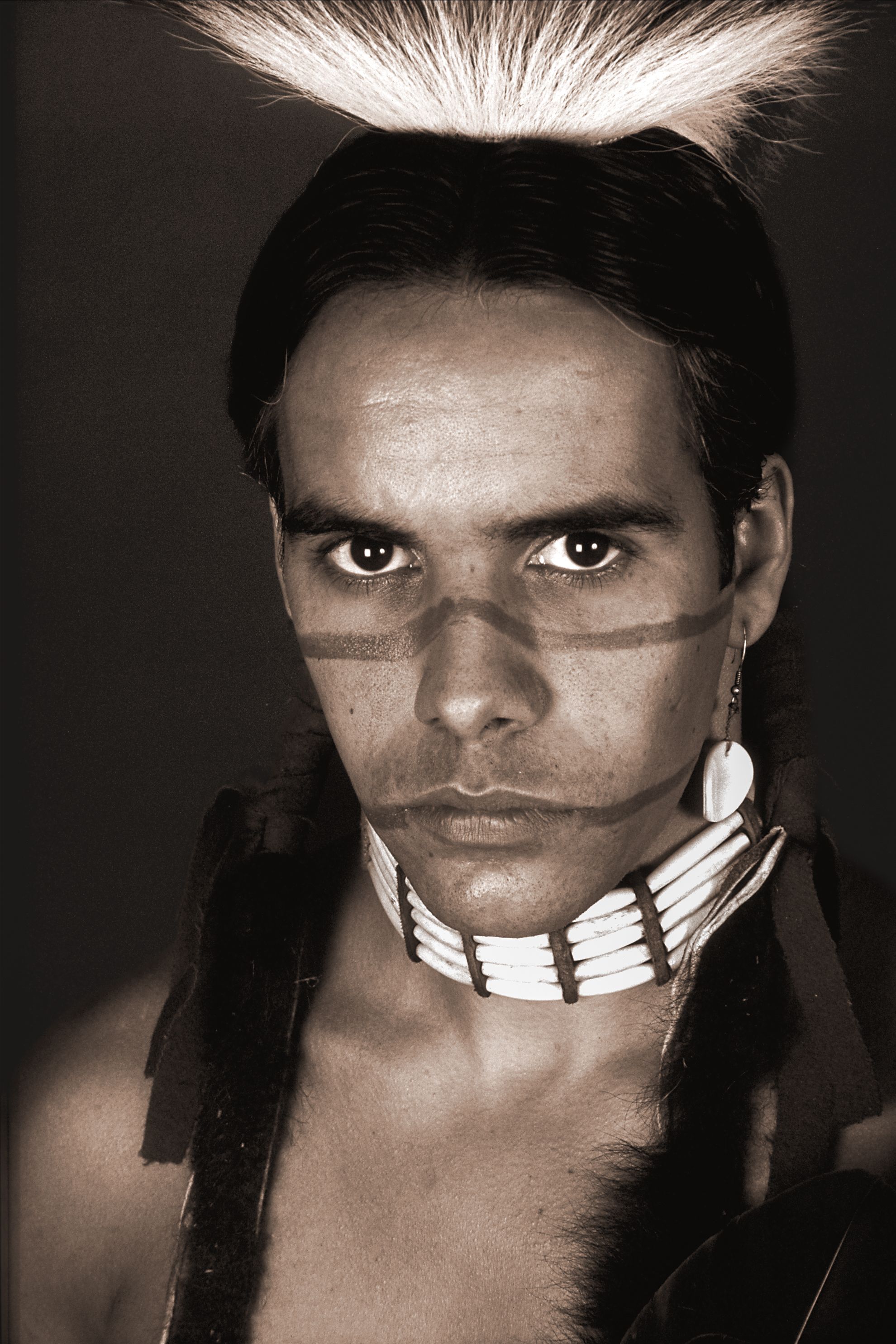 B&W portrait of male Native American in studio