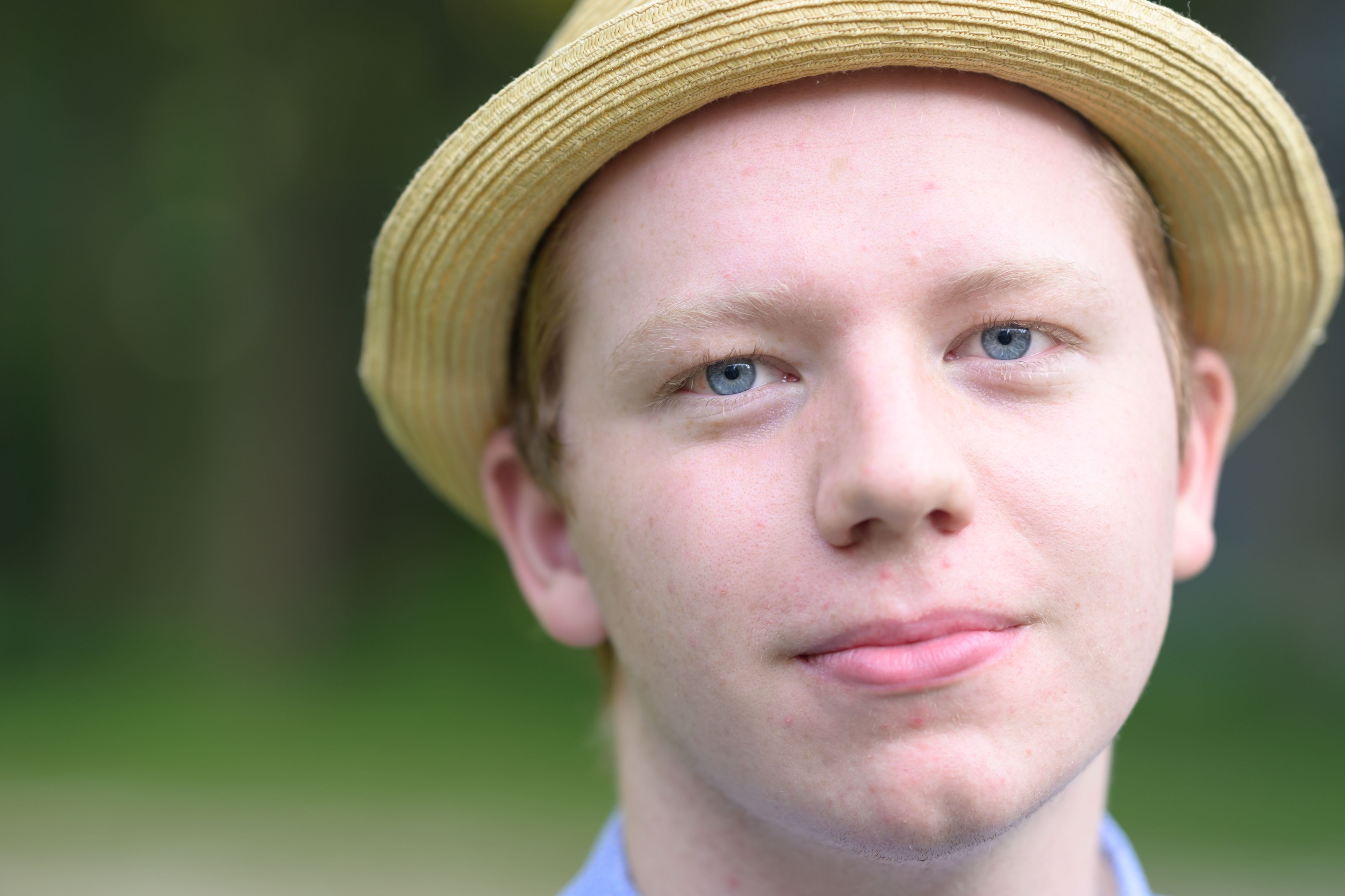 Closeup outdoor portrait of boy in hat