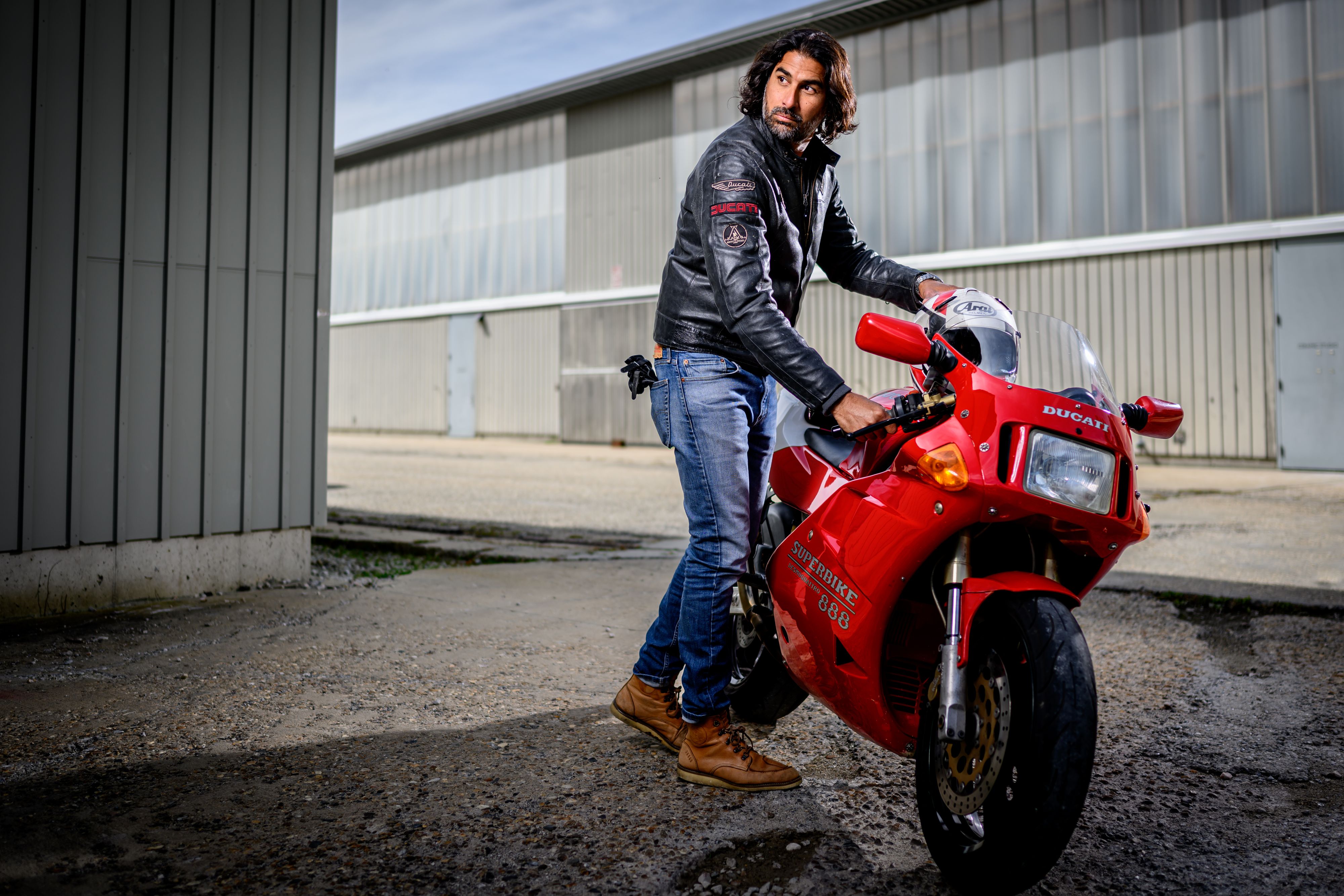 Man with red Ducati motorcycle