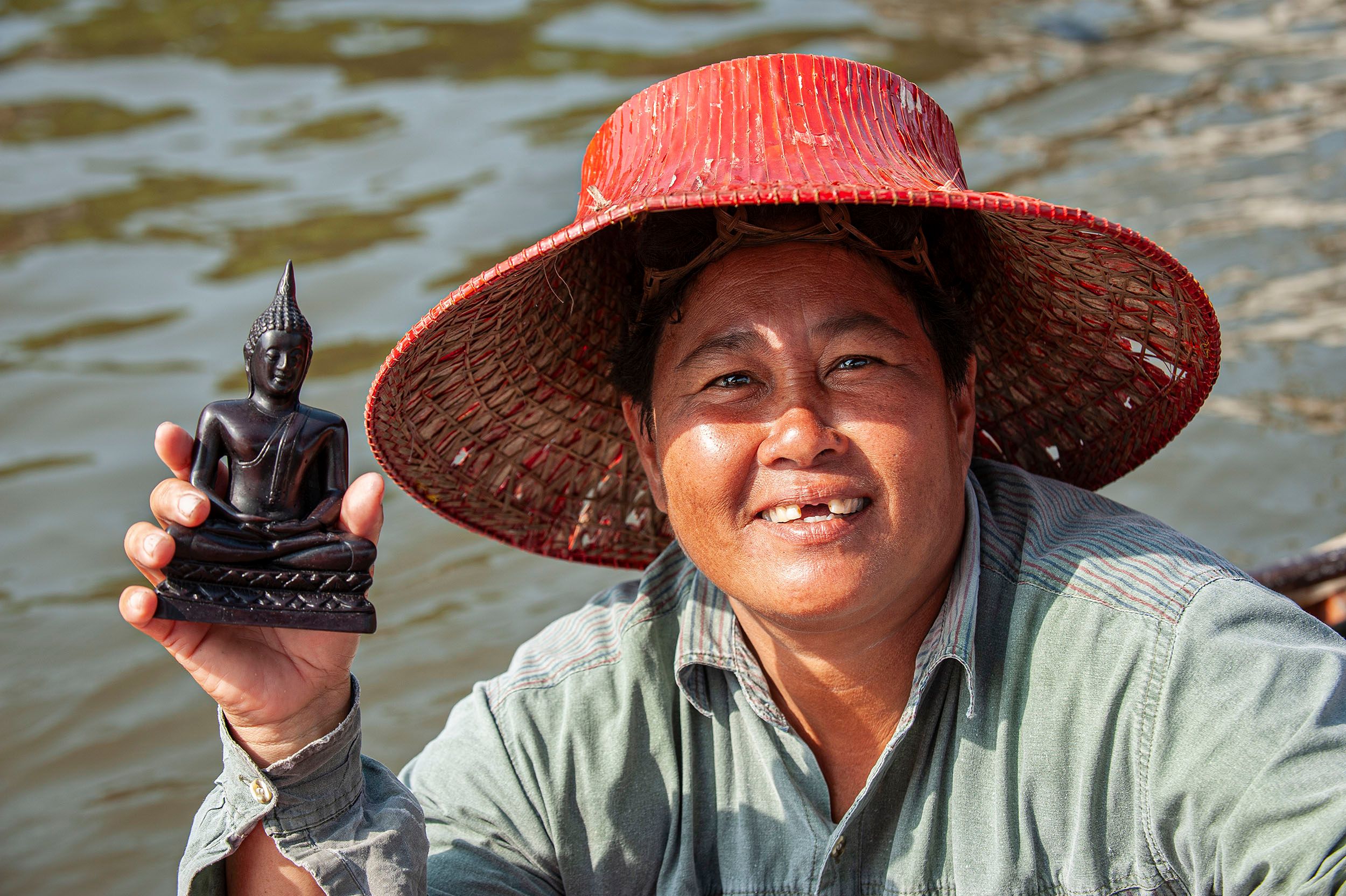 Woman with Buddha Statue