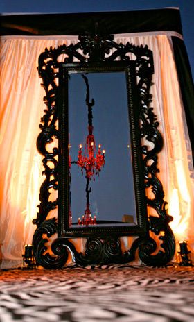 Large black framed mirror.