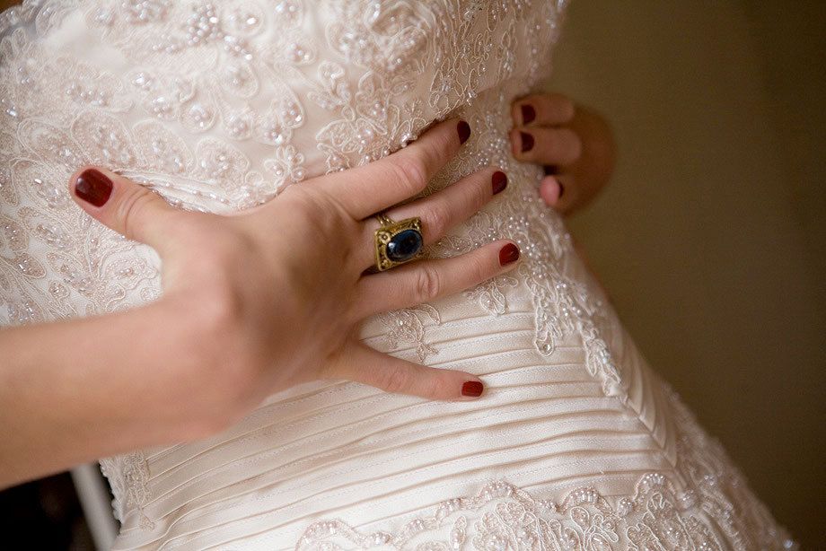 Detail of bride getting her dress on at the Inn.