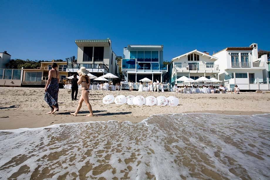 beach. water. umbrellas. wedding in Malibu.