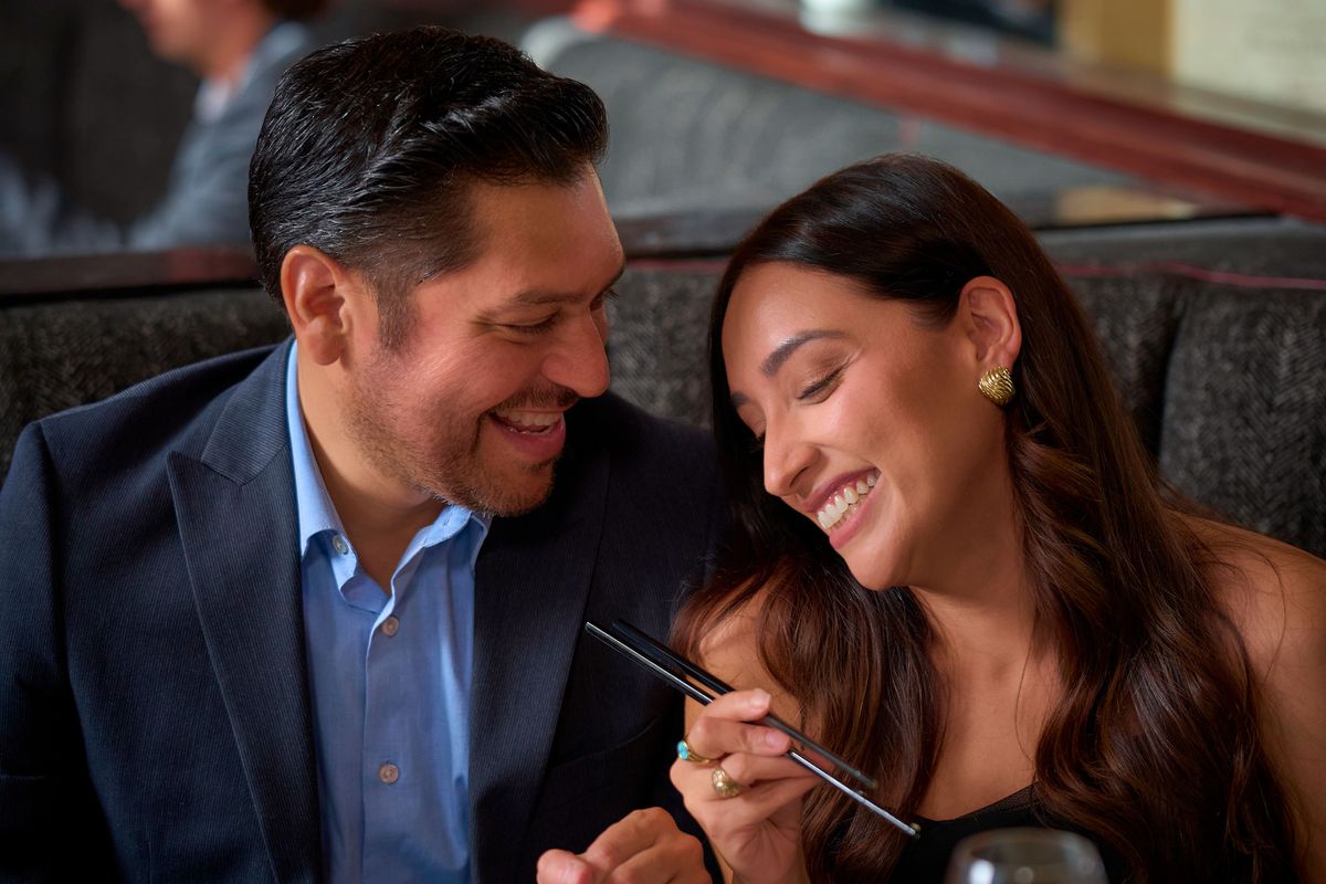 Couple enjoying romantic dinner at upscale restaurant