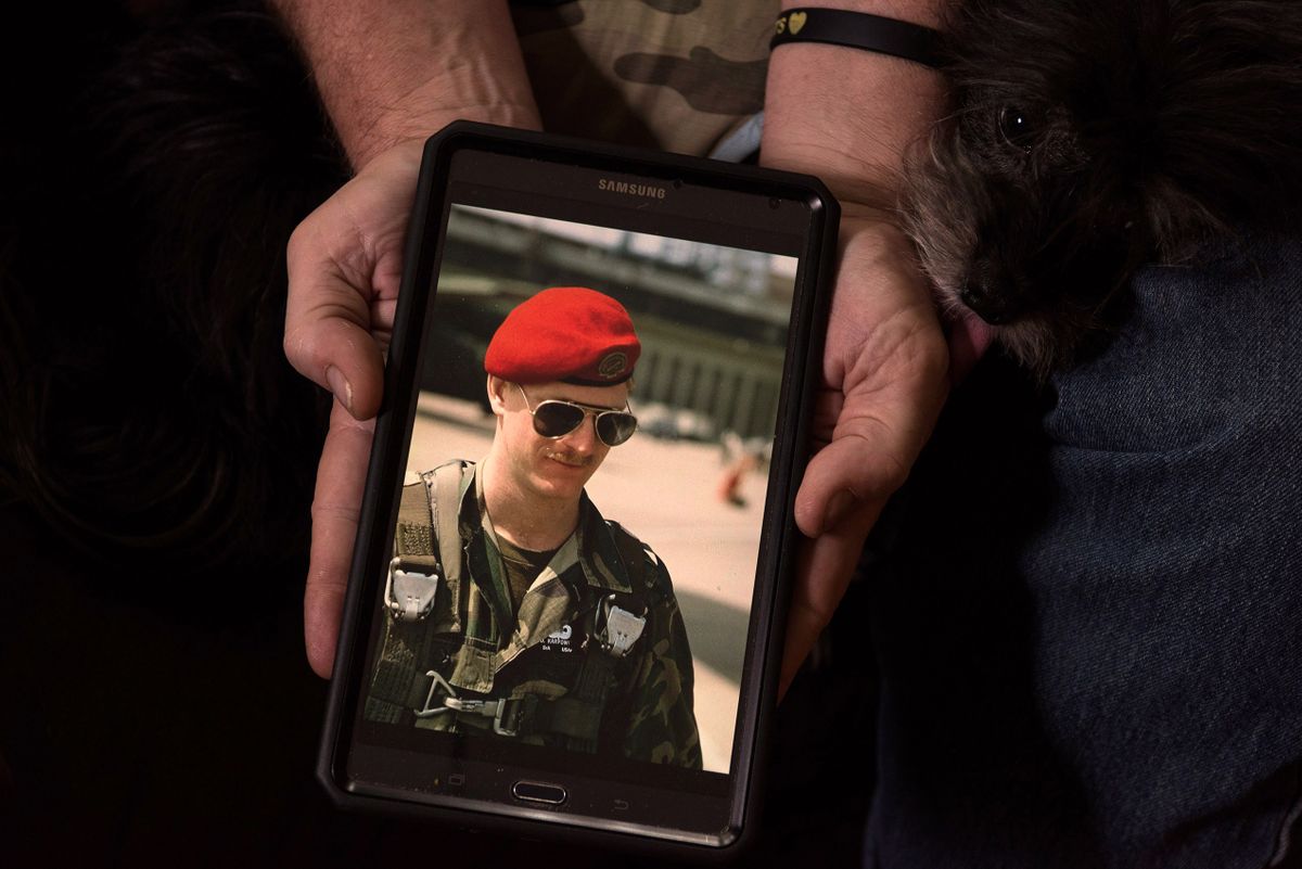 Don Karpowich displays a photo of himself from 1982 or 1983 taken in Germany when he was a Senior Airman. Special operator