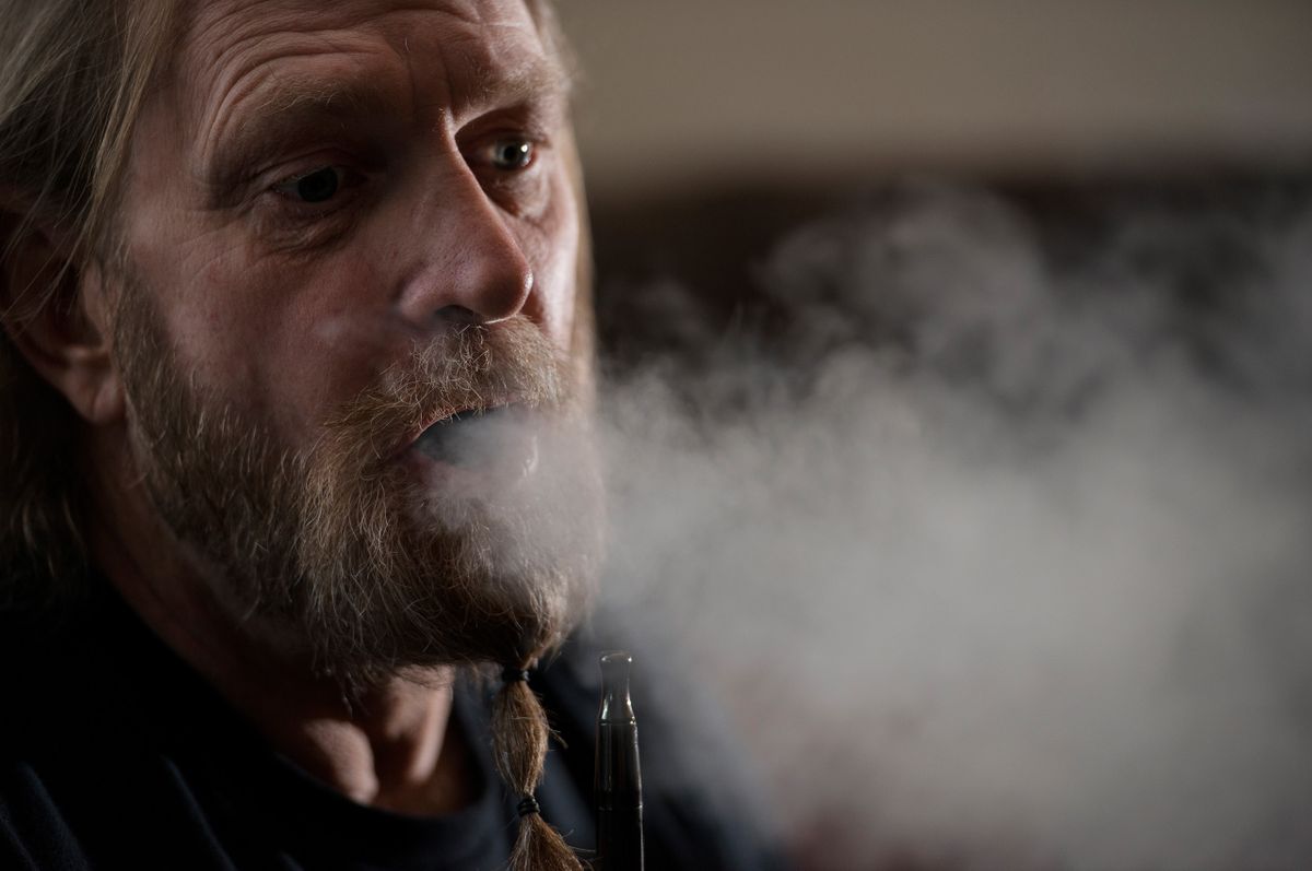 Air Force Combat Controller (CCT) veteran Don Karpowich at his home. Karpowich was in the Air Force from 1980 - 1993. He has PTS as a result of an event that he witnessed on 02-28-84 in which 18 people, including fellow servicemen, were killed. PTS is not a condition for which medical marijuana can be prescribed in NJ. He wants to see PTS added to the list of conditions that are treatable with medical marijuana. Karpowich exhales as he smokes marijuana. Don