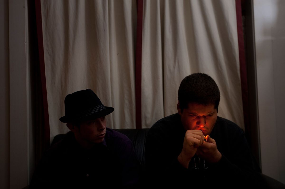 (right) Eric Haffner, 21, of Toms River, smokes marijuana as Andy Markoff, 23 of Middletown, looks on. Haffner says he smokes because it helps him with his PTS. Haffner can not legally get medical marijuana because people with PTS do not qualify in NJ. Markoff says he smokes because it helps him deal with back and knee pain, anxiety, and helps him fall asleep at night. Lighter