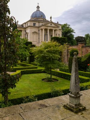 Color landscape photograph of the Neo-Palladian house and formal parterre gardens with a stone obelisk at Henbury Hall by William Curtis Rolf. Henbury Hall Cheshire Formal Garden Obelisk Color Print