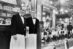Inquire to acquire official limited edition black and white fine art prints of the historic Brasserie Lipp interior in Paris by William Curtis Rolf, from the Objects & Architectural Details collection. William Curtis Rolf black and white photography Brasserie Lipp waiters dining room mirrors reflection Paris France Architectural Details Portfolio