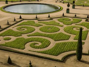 Color landscape photograph of the geometric Orangerie parterre and boxed citrus trees at the Palace of Versailles by William Curtis Rolf. Versailles France Orangerie Parterre Garden Color Print