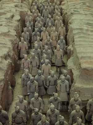 2013 color photograph of life-sized clay warriors inside the restricted subterranean excavation pits of the Terracotta Army in Xi'an by William Curtis Rolf. Xi'an Terracotta Army Emperor Qin Color Fine Art Print