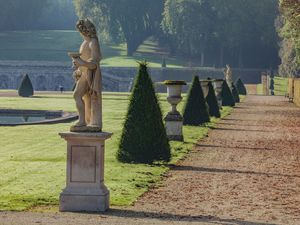 Fine-art color photograph by William Curtis Rolf capturing classical statues and forced perspective geometry in the André Le Nôtre gardens at Château de Vaux-le-Vicomte, France. Chateau de Vaux le Vicomte Garden Optical Illusion Fine Art Print