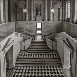 Square black and white architectural photograph of Gabriel's Staircase at the Palace of Versailles with checkered marble by William Curtis Rolf. Versailles Escalier Gabriel Square Black White Art Print