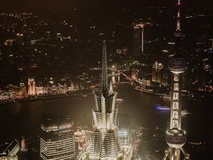 2013 color architectural photograph of the illuminated Oriental Pearl TV Tower and Pudong skyline at night in Shanghai by William Curtis Rolf. Shanghai Pudong Skyline Night Color Fine Art Print