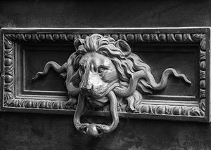 Inquire to acquire official limited edition black and white fine art prints of a historic Parisian lion door knocker by William Curtis Rolf, from the Objects & Architectural Details collection. William Curtis Rolf black and white photography lion door knocker antique Parisian entrance detail Paris France Architectural Details Portfolio