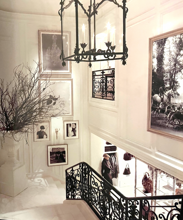 Installation photo of a 6x6 foot framed print of The Brocklesby Pack at a Check by William Curtis Rolf on the Grand Staircase at Ralph Lauren NYC. Ralph Lauren Flagship Grand Staircase William Curtis Rolf Print