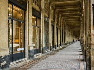 Color architectural photograph of the historic 18th-century stone arches at Galerie de Valois in Paris by William Curtis Rolf. Galerie de Valois Palais Royal Paris Color Print William Curtis Rolf