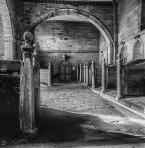 Black‑and‑white architectural view of the Palladian stables interior at Seaton Delaval Hall, Northumberland, photographed by William Curtis Rolf for The British Stable monograph. Highlights classical symmetry, vaulted stonework, and historic British equestrian heritage. Black‑and‑white interior view of the Palladian stables at Seaton Delaval Hall in Northumberland, England.