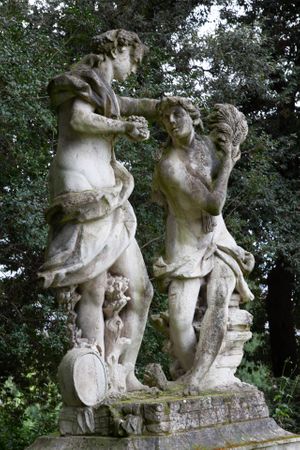 Architectural photograph of close-up stone sculptures against a background wall of trees at the Villa Bardini garden in Florence by William Curtis Rolf. Villa Bardini Garden Florence Statues Study 4 Color Print William Curtis Rolf