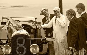 Fine-art sepia tone photograph by William Curtis Rolf capturing an antique pre-war Bentley with its owner in a white jumpsuit talking to judges at the Pebble Beach Concours d'Elegance. Pebble Beach Concours d Elegance 2009 Antique Bentley Sepia Print