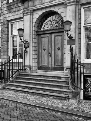 Inquire to acquire official limited edition black and white fine art prints of a historic Amsterdam canal house entrance by William Curtis Rolf, from the Objects & Architectural Details collection. William Curtis Rolf black and white photography Amsterdam canal house entrance architecture porch door Architectural Details Portfolio