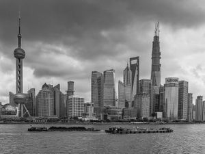2013 black and white architectural photograph of the Pudong skyline and Oriental Pearl TV Tower across the river from The Bund by William Curtis Rolf. Shanghai Bund to Pudong Skyline Black White Print